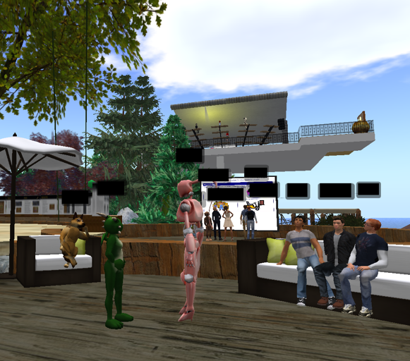 Two students carrying out a roleplay under the guise of their digital avatar within a virtual world. Other students in avatars are observing. In the background, there are a group of avatars standing around a large screen which displays module material for discussion.
