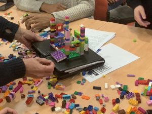 Students trying to write a news story using Lego brick