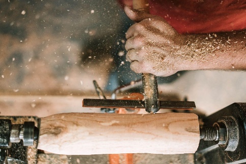 Man turning wood