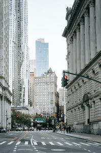 Photograph of city buildings, including a skyscraper