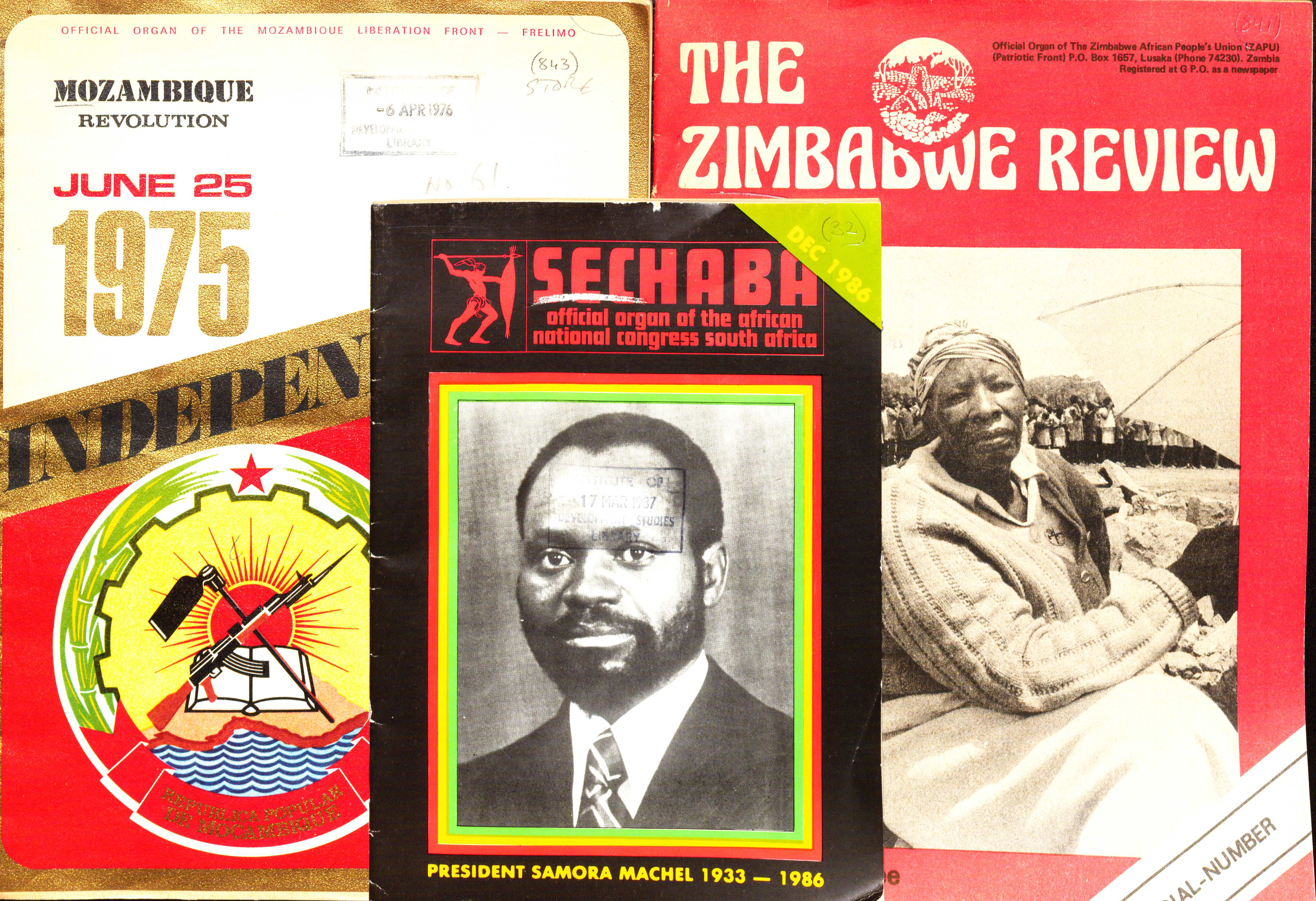 Image credit: Photograph of montage of African journals. Copyright Daniel Millum (2024). Used with kind permission. All rights reserved. A montage of covers of FRELIMO, ZAPU, ANC magazines. The cover on the left red and white. It is dated June 25 1975 and has 'Mozambique Revolution' in the top left corner. The image shows a sunset over waves with a gun, a book and a hand axe on top. The cover in the middle is black, with a black and white photograph of Samora Machel dressed in a suit and tie. Below the photo are the words 'President Samora Machel 1933 – 1986'. The cover on the right is red with white text. the title is 'The Zimbabwe Review'. There is a black and white photograph in the middle of the cover showing a woman wearing looking directly at the camera and holding an umbrella. Behind her is just visible a row of people.