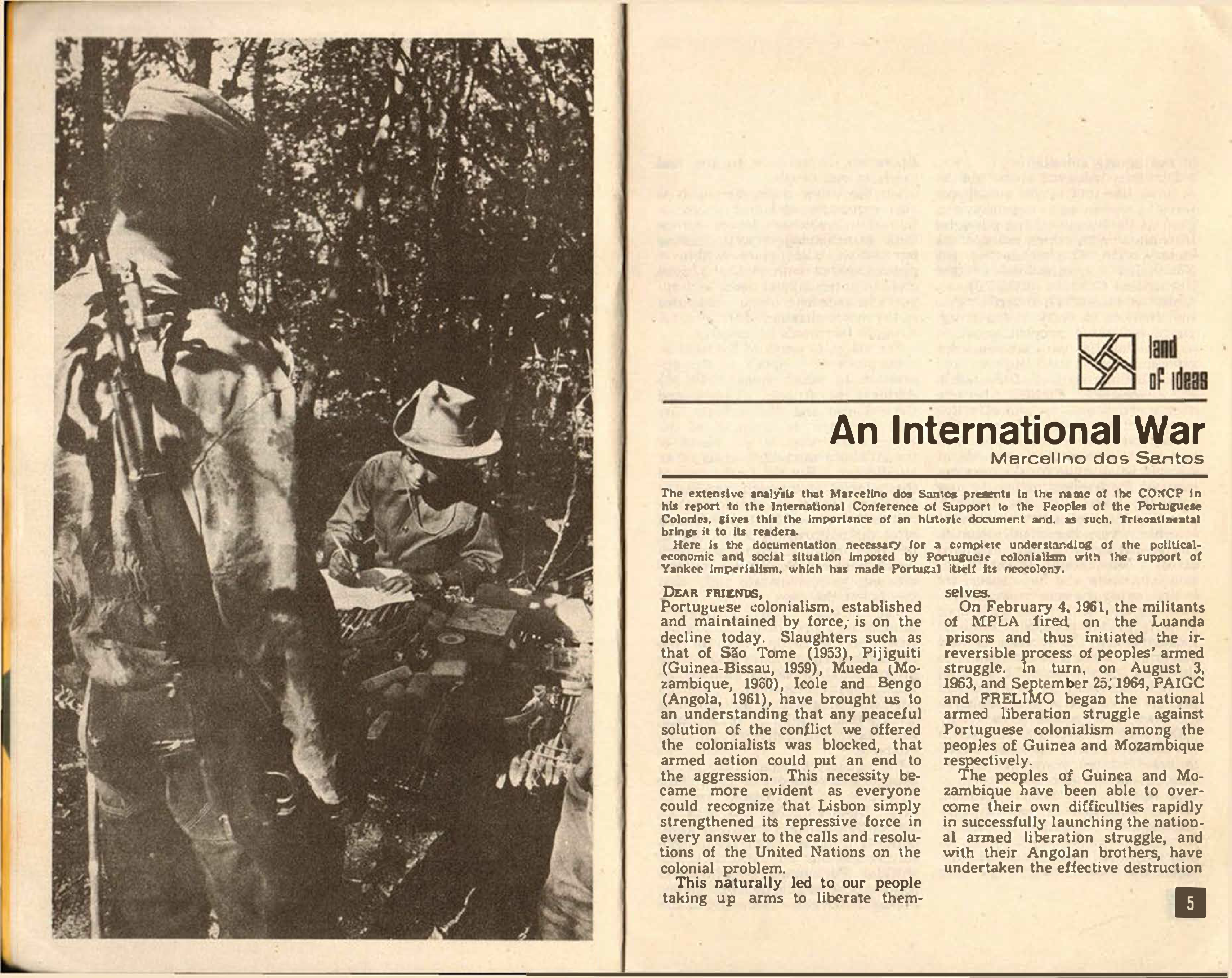 Image credit: Copyright OSPAAAL (1971). Tricontinental Review, No. 23, pages 4-5. Accessed via British Library for Development Studies Legacy Collection. Scan copyright University of Sussex (2024). Used with kind permission. All rights reserved. A booklet open on a double-page spread. On the right is a photograph that take up the whole page. It is a black and white photo of a soldier (facing away from the camera with a rifle slung over his shoulder) looking down as a person sitting a desk in front of him notes something down on a sheet of paper. Behind them are trees. On the left is the first page of an article titled 'An International War' by Marcellino dos Santos.