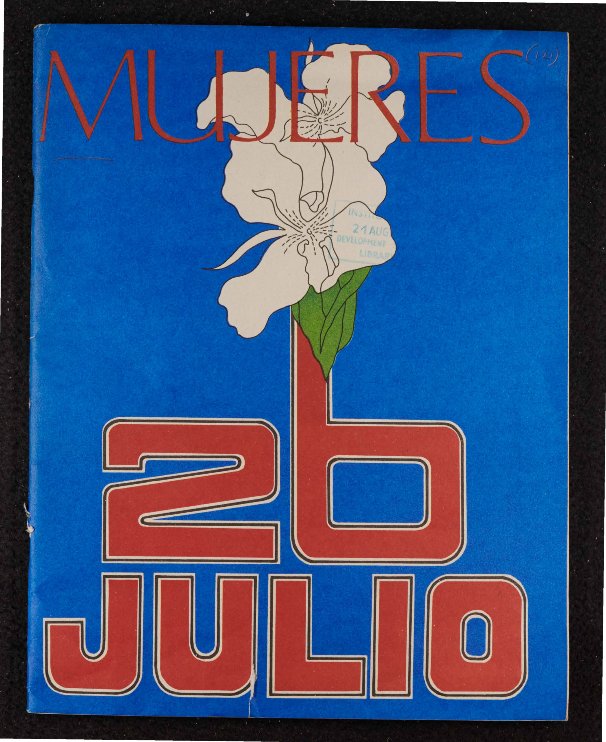 Front cover of Mujeres, 26 July anniversary special. '26 Julio' is in heavy red font towards the base of the cover, with a white flower growing out of the number six, all set against a vibrant cobalt blue background.