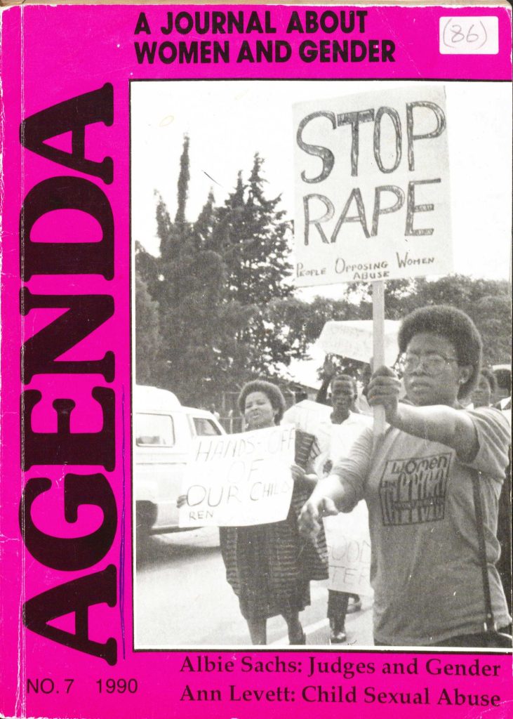 Image credit: Copyright Agenda (1990). Front cover, No. 7. Accessed via the British Library for Development Studies Legacy Collection. Scan copyright University of Sussex (2024). Used with kind permission. All rights reserved. Front cover of Agenda, no. 7 (1990), depicting a black and white photograph of a woman with a 'Stop Rape' sign in the foreground of a protest group of women. The border of the cover is fuchsia pink.